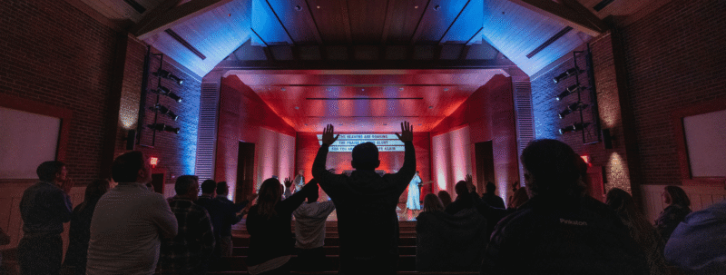 Christian worshipping God at a church